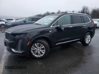 2023 Cadillac XT6 AWD Luxury with VIN 1GYKPBR41PZ110836, listed as a Copart auction lot 84441314 with 77,023 mi miles and Salvage Title. Bid and sale history available at carsss.com. Image 1.