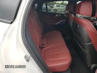 2022 BMW X6 xDrive40i z VIN 5UXCY6C08N9J21980, wystawiony jako Copart lot #48819745 z przebiegiem 24 431 mil mil oraz Szkoda całkowita • Salvage title. Historia ofert i sprzedaży dostępna na DreamBid. Obrazek 11.