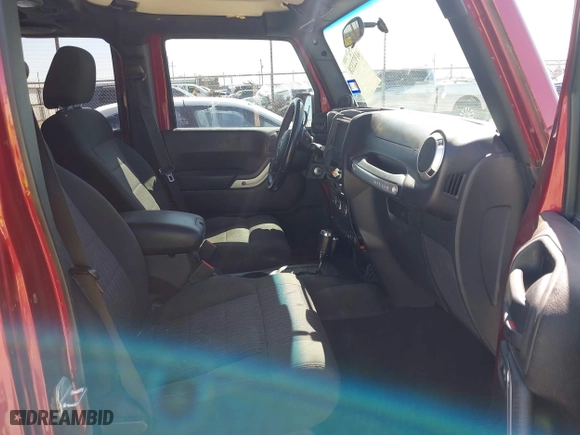 2011 Jeep Wrangler Unlimited Sahara with VIN 1J4BA5H15BL557871, listed as a IAAI auction lot 41922328 with 206,581 mi miles. Bid and sale history available at carsss.com. Image 5.