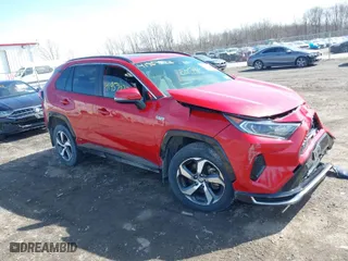 2021 Toyota RAV4 Prime SE with VIN JTMAB3FV2MD059200, listed as a IAAI auction lot 41957023 with 27,451 mi miles. Bid and sale history available at carsss.com. Image 1.