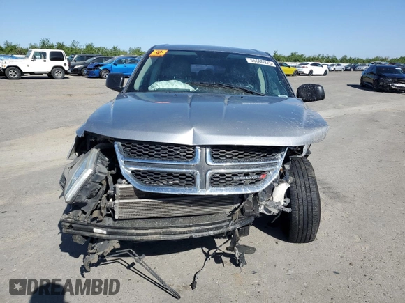 2015 Dodge Journey American Value with VIN 3C4PDCABXFT712192, listed as a Copart auction lot 55680975 with 104,579 mi miles and Salvage Title. Bid and sale history available at DreamBid. Image 5.