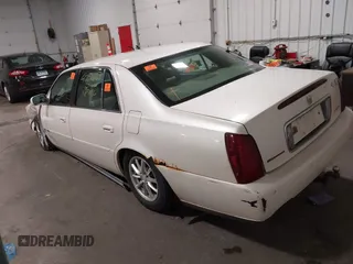 2003 Cadillac DeVille with VIN 1G6KD54Y63U178022, listed as a IAAI auction lot 42076667 with 141,863 mi miles. Bid and sale history available at carsss.com. Image 3.