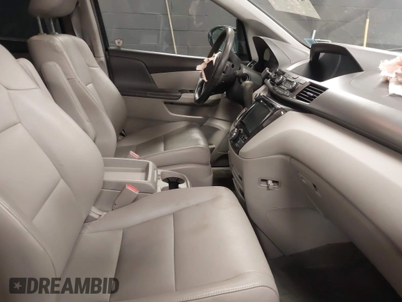 2014 Honda Odyssey Touring with VIN 5FNRL5H94EB105745, listed as a IAAI auction lot 41744012 with 77,032 mi miles and . Bid and sale history available at DreamBid. Image 5.