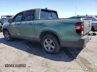 2022 Honda Ridgeline RTL-E with VIN 5FPYK3F73NB014672, listed as a Copart auction lot 54617475 with 76,160 mi miles and Salvage title. Bid and sale history available at DreamBid. Image 2.