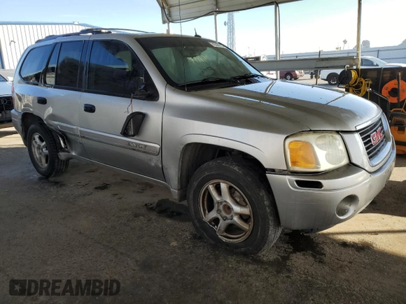 2005 GMC Envoy SLE with VIN 1GKDS13S852374516, listed as a Copart auction lot 42409725 with 299,816 mi miles and Salvage Title. Bid and sale history available at carsss.com. Image 4.