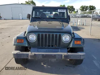 2002 Jeep Wrangler SE z VIN 1J4FA29P72P711802, wystawiony jako Copart lot #52640405 z przebiegiem 107 046 mil mil oraz Czysty tytuł • Clean title. Historia ofert i sprzedaży dostępna na DreamBid. Obrazek 5.