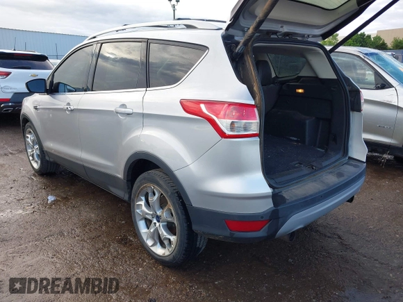 2013 Ford Escape Titanium with VIN 1FMCU0J90DUC13877, listed as a IAAI auction lot 42370172 with 119,745 mi miles and . Bid and sale history available at DreamBid. Image 3.