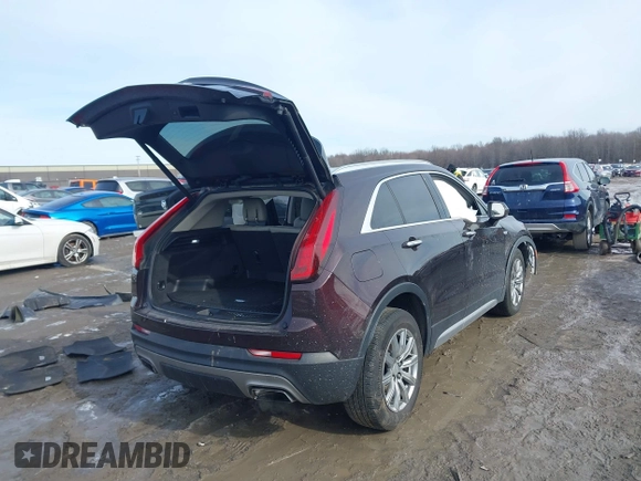 2020 Cadillac XT4 AWD Premium Luxury z VIN 1GYFZDR4XLF085471, wystawiony jako IAAI lot #41528080 z przebiegiem 58 136 mil mil oraz . Historia ofert i sprzedaży dostępna na DreamBid. Obrazek 4.