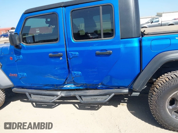 2023 Jeep Gladiator Rubicon with VIN 1C6JJTBG3PL581023, listed as a IAAI auction lot 41963931 with 15,023 mi miles and . Bid and sale history available at DreamBid. Image 15.