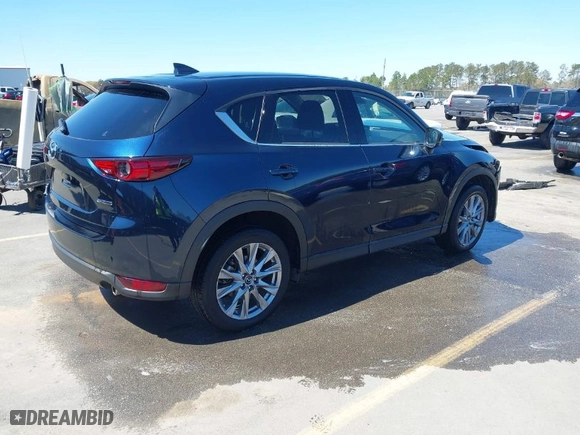 2021 Mazda CX-5 Grand Touring with VIN JM3KFBDM8M1426932, listed as a IAAI auction lot 41847448 with 17,933 mi miles. Bid and sale history available at carsss.com. Image 4.