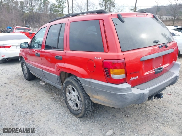 1999 Jeep Grand Cherokee Laredo with VIN 1J4GW58S0XC519908, listed as a IAAI auction lot 41789905 with 221,064 mi miles. Bid and sale history available at carsss.com. Image 3.