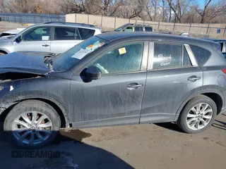 2014 Mazda CX-5 Grand Touring with VIN JM3KE2DY1E0421326, listed as a IAAI auction lot 41330794 with 127,589 mi miles. Bid and sale history available at carsss.com. Image 14.