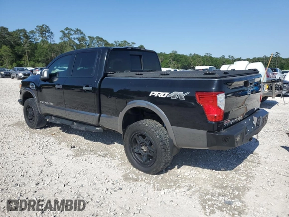 2016 Nissan Titan SL z VIN 1N6BA1F4XGN509402, wystawiony jako Copart lot #52410795 z przebiegiem 37 421 mil mil oraz Szkoda całkowita • Salvage title. Historia ofert i sprzedaży dostępna na DreamBid. Obrazek 2.