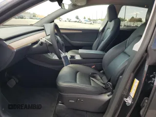 2025 Tesla Model Y Long Range with VIN 7SAYGDED8SF241779, listed as a Copart auction lot 51899205 with 12,409 mi miles and Salvage Title. Bid and sale history available at DreamBid. Image 7.