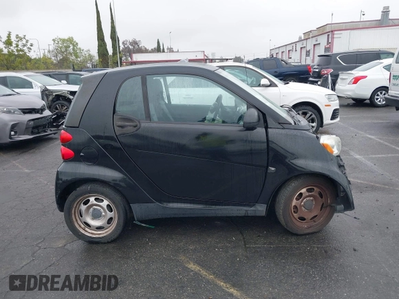 2012 Smart fortwo Pure z VIN WMEEJ3BA9CK521416, wystawiony jako IAAI lot #41847989 z przebiegiem Nie podano mil oraz . Historia ofert i sprzedaży dostępna na DreamBid. Obrazek 14.