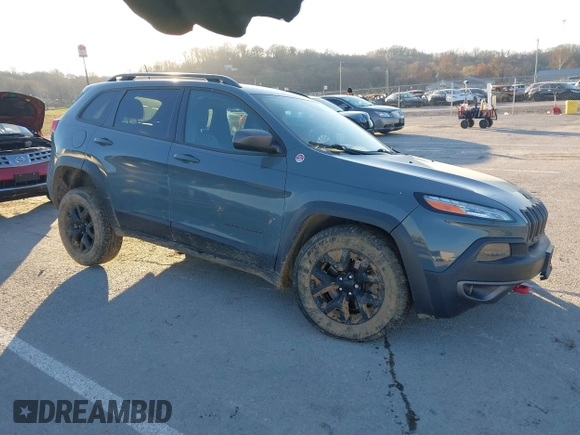 2015 Jeep Cherokee Trailhawk with VIN 1C4PJMBSXFW614416, listed as a IAAI auction lot 41033241 with 112,015 mi miles. Bid and sale history available at carsss.com. Image 1.