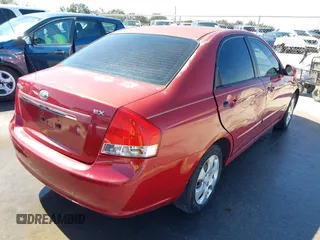 2009 Kia Spectra EX with VIN KNAFE221195606045, listed as a IAAI auction lot 41764519 with 124,577 mi miles. Bid and sale history available at carsss.com. Image 4.