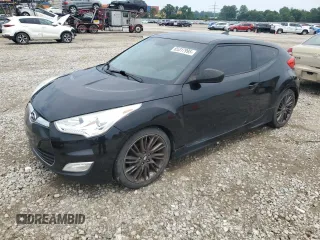 2013 Hyundai Veloster w/Red Int с VIN KMHTC6AD0DU141945, выставлен на аукционе Copart как лот 65317995 с пробегом 87 443 миль миль и Чистый • Clean title. История ставок и продаж доступна на DreamBid. Изображение 1.