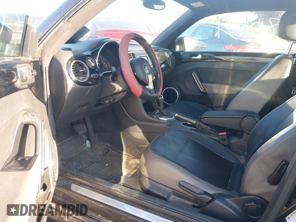 2012 Volkswagen Beetle 2.5L w/Sound/Nav PZEV with VIN 3VWJP7AT7CM661055, listed as a IAAI auction lot 41980159 with 113,678 mi miles and . Bid and sale history available at DreamBid. Image 5.