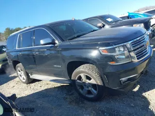 2015 Chevrolet Tahoe LTZ with VIN 1GNSKCKC3FR222135, listed as a IAAI auction lot 41816033 with 180,393 mi miles. Bid and sale history available at carsss.com. Image 13.