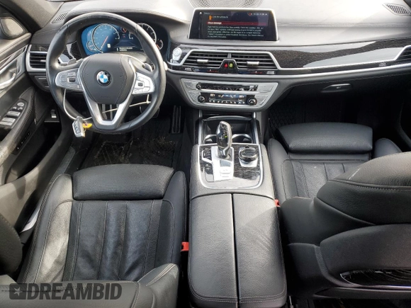 2019 BMW 7 Series 740i xDrive z VIN WBA7E4C50KGV28241, wystawiony jako Copart lot #87329774 z przebiegiem Nie podano mil oraz Szkoda całkowita • Salvage title. Historia ofert i sprzedaży dostępna na DreamBid. Obrazek 8.
