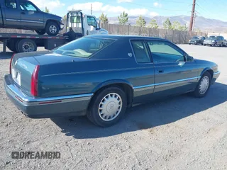 1993 Cadillac Eldorado ESC z VIN 1G6EL12Y4PU609197, wystawiony jako IAAI lot #41902066 z przebiegiem 96 251 mil mil oraz . Historia ofert i sprzedaży dostępna na DreamBid. Obrazek 4.