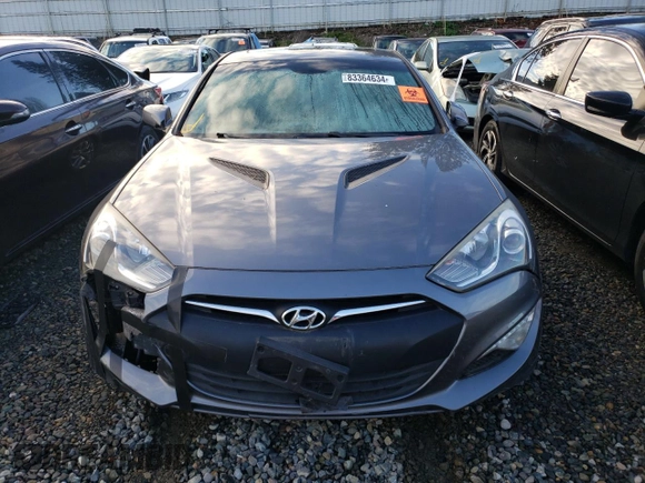 2014 Hyundai Genesis Coupe 2.0T z VIN KMHHT6KD6EU119079, wystawiony jako Copart lot #83364634 z przebiegiem 85 647 mil mil oraz Szkoda całkowita • Salvage title. Historia ofert i sprzedaży dostępna na DreamBid. Obrazek 5.