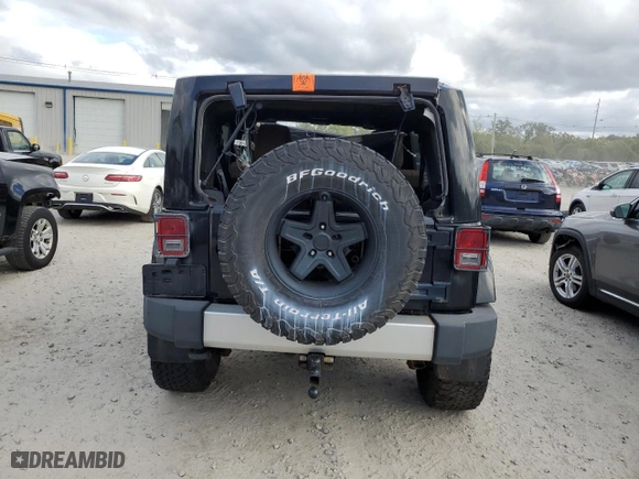 2011 Jeep Wrangler Unlimited Sahara with VIN 1J4HA5H19BL623123, listed as a Copart auction lot 72860734 with 0 mi miles and Non Repairable. Bid and sale history available at carsss.com. Image 6.