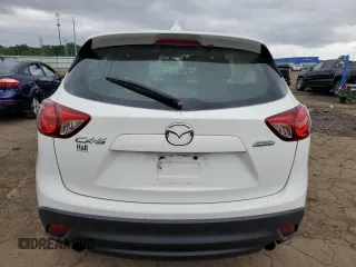 2014 Mazda CX-5 Sport with VIN JM3KE2BE8E0374434, listed as a Copart auction lot 61615445 with 111,330 mi miles and Clean title. Bid and sale history available at DreamBid. Image 6.