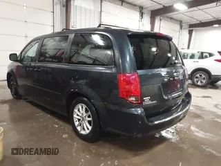 2014 Dodge Grand Caravan SXT with VIN 2C4RDGCGXER154709, listed as a IAAI auction lot 41117603 with 214,872 mi miles and . Bid and sale history available at DreamBid. Image 3.