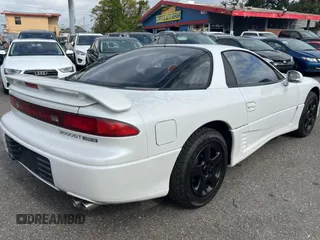1992 Mitsubishi 3000GT z VIN JA3XE74CXNY058167, wystawiony jako Copart lot #84192254 z przebiegiem 69 411 mil mil oraz Tytuł czysty. Historia ofert i sprzedaży dostępna na DreamBid. Obrazek 4.