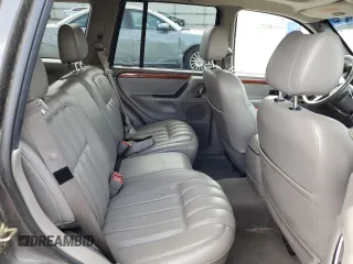 1999 Jeep Grand Cherokee Limited with VIN 1J4GW68S6XC713297, listed as a Copart auction lot 55264384 with 98,912 mi miles and Salvage Title. Bid and sale history available at carsss.com. Image 11.