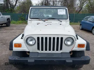 1998 Jeep Wrangler Sport with VIN 1J4FY19S0WP779147, listed as a IAAI auction lot 42045723 with 205,822 mi miles. Bid and sale history available at carsss.com. Image 6.