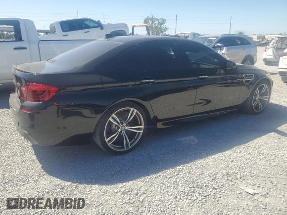 2014 BMW M5 z VIN WBSFV9C52ED593005, wystawiony jako Copart lot #49054395 z przebiegiem 71 213 mil mil oraz Szkoda całkowita • Salvage title. Historia ofert i sprzedaży dostępna na DreamBid. Obrazek 3.