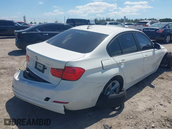 2014 BMW 3 Series 320i with VIN WBA3B1C51EK131063, listed as a IAAI auction lot 42043086 with 92,306 mi miles. Bid and sale history available at carsss.com. Image 4.