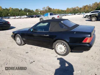 1997 Mercedes-Benz SL-Class with VIN WDBFA67F9VF146887, listed as a Copart auction lot 77166464 with 0 mi miles and Salvage Title. Bid and sale history available at carsss.com. Image 2.