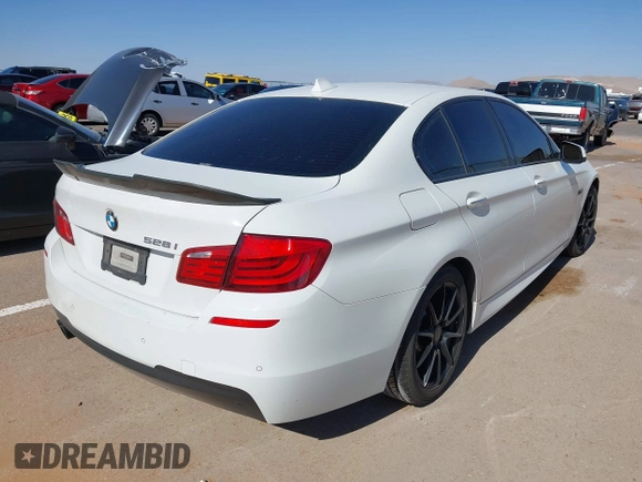2013 BMW 5 Series 528i with VIN WBAXG5C56DD230121, listed as a IAAI auction lot 42019899 with 142,100 mi miles and . Bid and sale history available at carsss.com. Image 4.