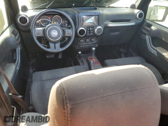 2012 Jeep Wrangler Unlimited Sahara with VIN 1C4BJWEG5CL235835, listed as a Copart auction lot 60673555 with 86,606 mi miles and Salvage title. Bid and sale history available at DreamBid. Image 8.