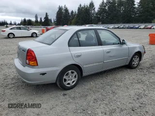 2005 Hyundai Accent GLS z VIN KMHCG45C75U639281, wystawiony jako Copart lot #54887095 z przebiegiem 136 090 mil mil oraz Szkoda całkowita • Salvage title. Historia ofert i sprzedaży dostępna na DreamBid. Obrazek 3.