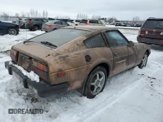 1979 Datsun 280ZX z VIN HS130137808, wystawiony jako Copart lot #43799165 z przebiegiem 28 995 mil mil oraz Tytuł czysty. Historia ofert i sprzedaży dostępna na DreamBid. Obrazek 3.