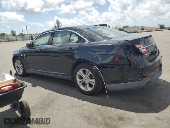 2015 Ford Taurus SE with VIN 1FAHP2D86FG140750, listed as a Copart auction lot 54390145 with 128,163 mi miles and Salvage Title. Bid and sale history available at carsss.com. Image 2.