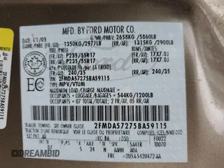 2005 Ford Freestar z VIN 2FMDA57275BA59115, wystawiony jako Copart lot #57058445 z przebiegiem 100 831 mil mil oraz Szkoda całkowita • Salvage title. Historia ofert i sprzedaży dostępna na DreamBid. Obrazek 13.