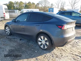 2022 Tesla Model Y Long Range with VIN 7SAYGAEE6NF361883, listed as a IAAI auction lot 41752441 with 50,493 mi miles and . Bid and sale history available at DreamBid. Image 3.