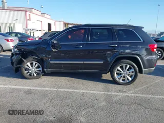 2013 Jeep Grand Cherokee Laredo with VIN 1C4RJEAG2DC643290, listed as a IAAI auction lot 41751696 with 125,258 mi miles. Bid and sale history available at carsss.com. Image 14.