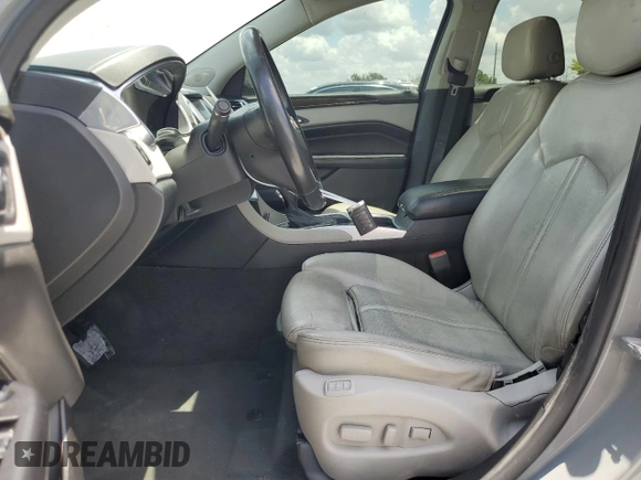 2014 Cadillac SRX Premium Collection z VIN 3GYFNGE30ES627895, wystawiony jako Copart lot #58605985 z przebiegiem 49 300 mil mil oraz Szkoda całkowita • Salvage title. Historia ofert i sprzedaży dostępna na DreamBid. Obrazek 7.
