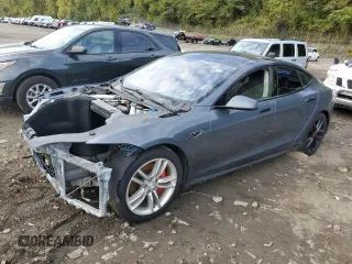 2014 Tesla Model S 60 with VIN 5YJSA1H14EFP28471, listed as a Copart auction lot 73715834 with 99,442 mi miles and Clean Title. Bid and sale history available at DreamBid. Image 1.