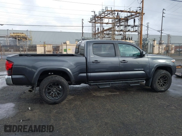 2022 Toyota Tacoma SR5 with VIN 3TMBZ5DN2NM034561, listed as a IAAI auction lot 40867443 with 51,728 mi miles and . Bid and sale history available at DreamBid. Image 13.