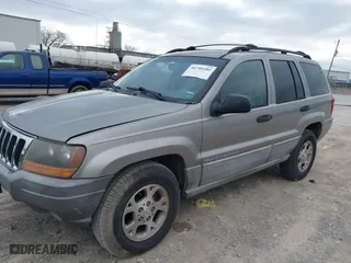 1999 Jeep Grand Cherokee Laredo with VIN 1J4GW58N4XC676836, listed as a IAAI auction lot 41799381 with 203,784 mi miles. Bid and sale history available at carsss.com. Image 2.