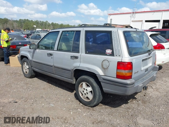 1994 Jeep Grand Cherokee Laredo with VIN 1J4GZ58Y0RC200247, listed as a IAAI auction lot 41781078 with 217,698 mi miles. Bid and sale history available at carsss.com. Image 3.