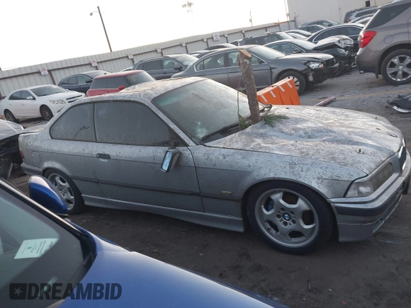 1998 BMW 3 Series 328is with VIN WBABG1329WET06968, listed as a IAAI auction lot 41656215 with 270,000 mi miles. Bid and sale history available at carsss.com. Image 13.